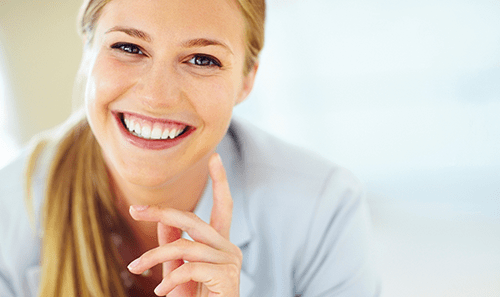 Girl Smiling at Cosmetic Dentist